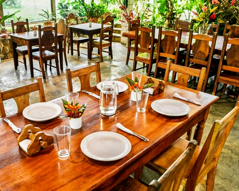 Rustic restaurant at Santa Maria Volcano Lodge — traditional Costa Rican cuisine